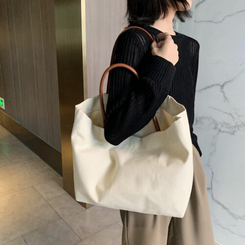 Korean version of large-capacity lazy wind ins hand shoulder bag environmental shopping bag simple literary canvas bag schoolbag female - Image 2